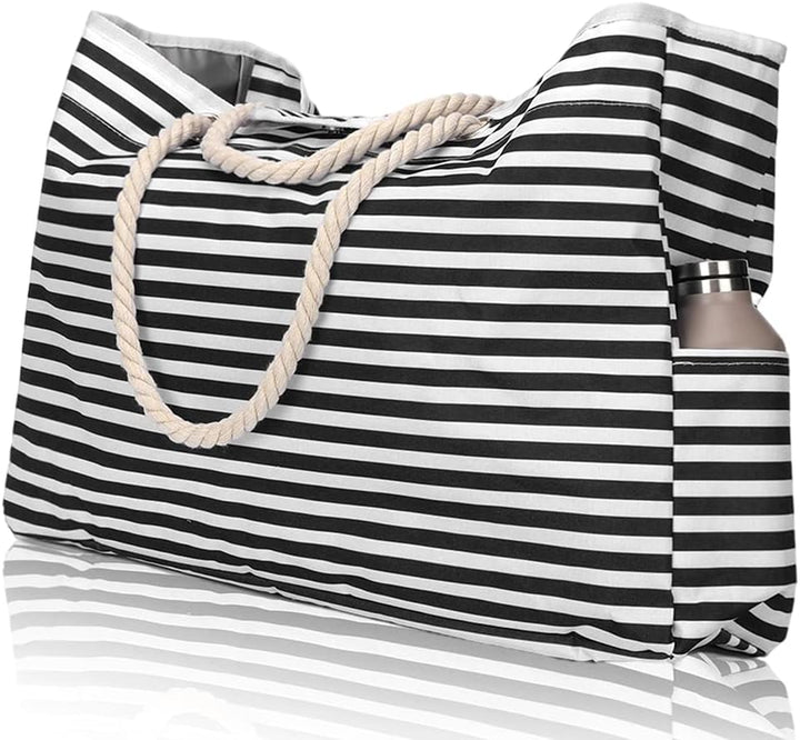 Waterproof travel tote bag, shown with its bonus matching pouch, offering ample storage for family beach trips.