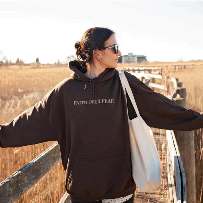 Close-up of "Faith Over Fear" and Psalm 118:6 print on a soft, quality Christian unisex hoodie.
