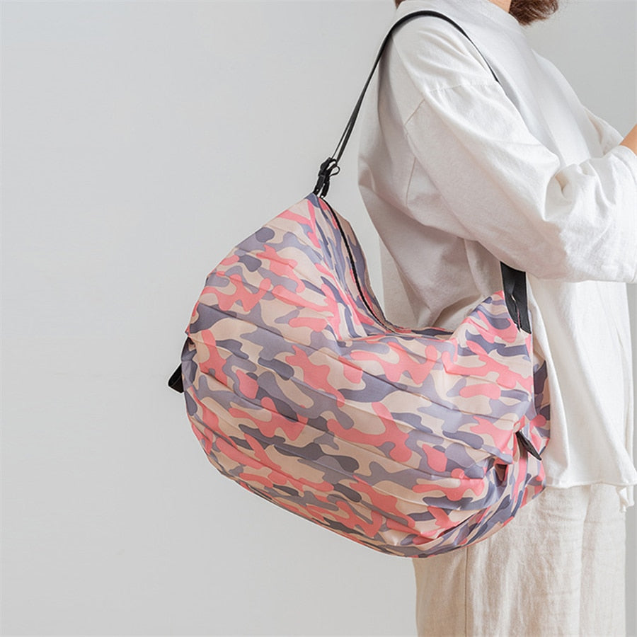 Eco-friendly unisex foldable shopping tote bag. Durable oxford fabric for sustainable grocery trips & reusable utility.