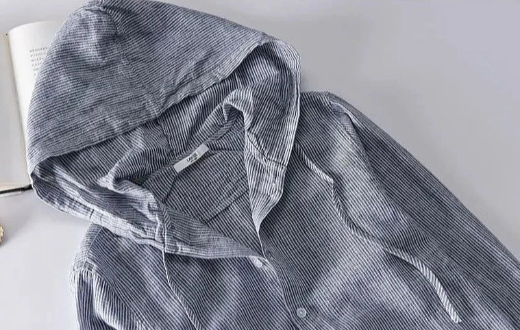 Unisex hooded shirt in lightweight fabric, showcasing breathable material and casual design with versatile unisex fit.