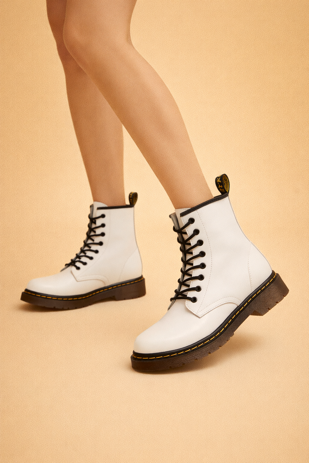 Close-up of unisex insulated lace-up ankle boots, highlighting durable material & comfortable design for cold weather.