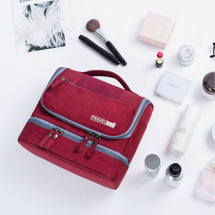 Large unisex travel toiletry bag, multi-compartment organizer for vacation essentials & accessories.