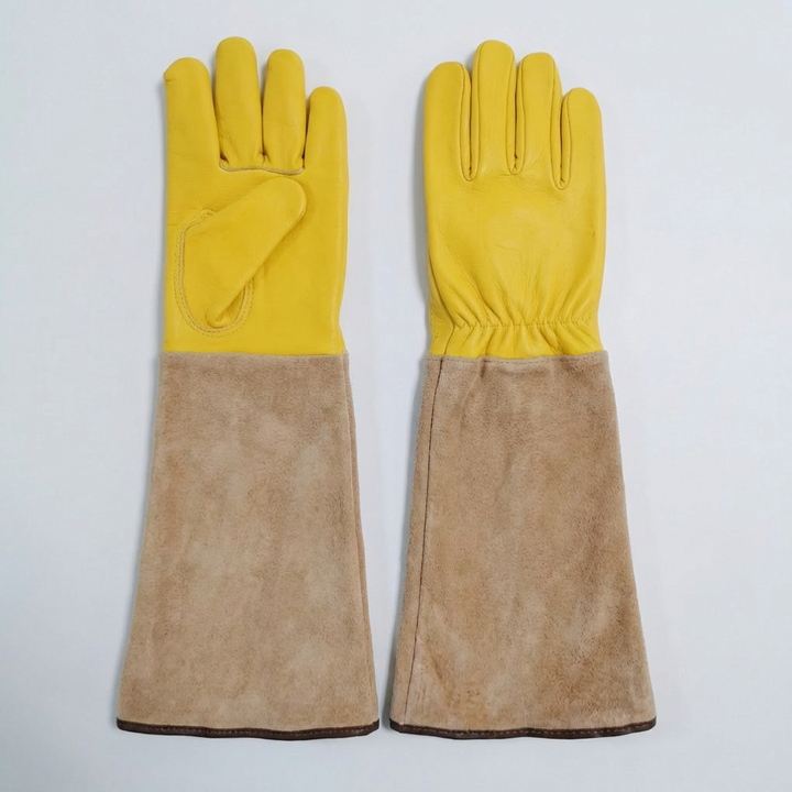 Unisex long gardening gloves in yellow, offering superior arm protection for planting, pruning, and digging tasks.