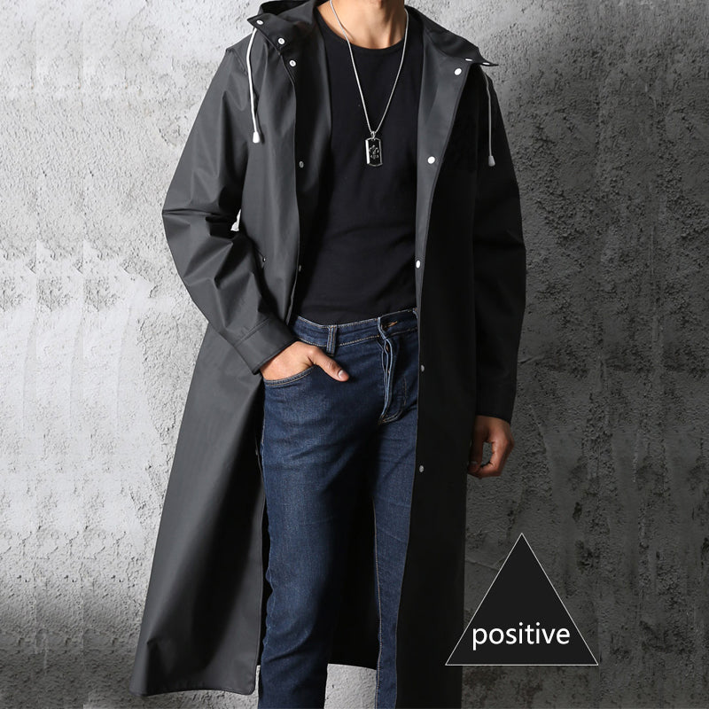 Unisex long waterproof raincoat with hood, ideal for all-weather outdoor adventures & travel.