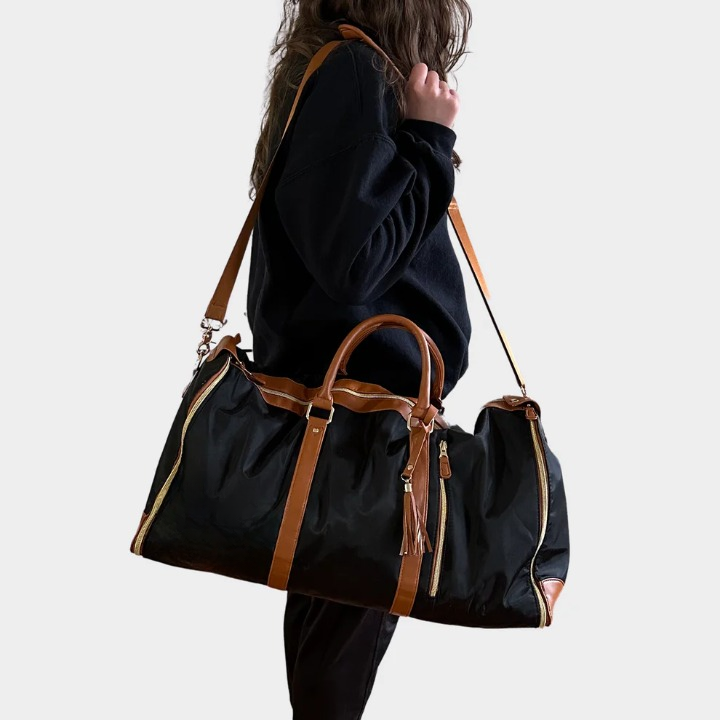 Compact wrinkle-free garment travel duffel bag. Unisex, stylish carry-on luggage in premium vegan leather for trips.