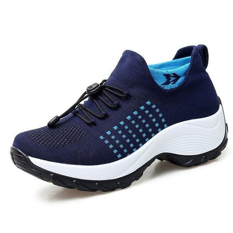 A person walking in black unisex ortho stretch cushion shoes, ideal for active lifestyles and all-day comfort.