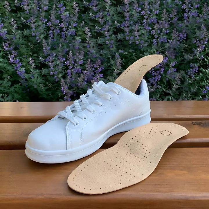 "Unisex orthopedic leather shoe insole with shock absorption, arch support, and moisture-wicking for foot pain relief."
