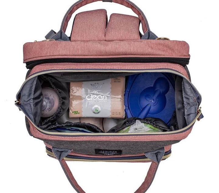 Portable baby bed and diaper bag for travel, a waterproof nappy backpack with changing station.