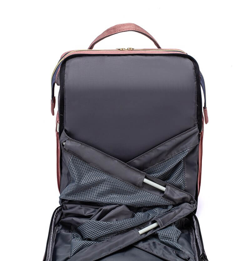On-the-go changing station and portable bed within this versatile baby travel backpack.