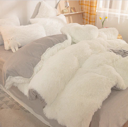 Stylish plush duvet cover draped on a bed, creating a cozy and warm winter bedroom haven.