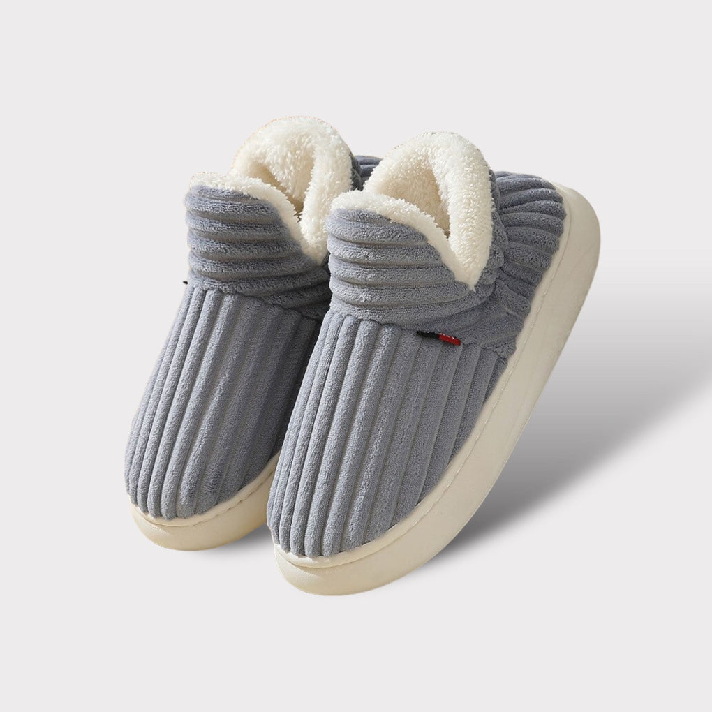Warm & ergonomic plush unisex slippers, ideal for ultimate indoor comfort. A cozy footwear gift for all.
