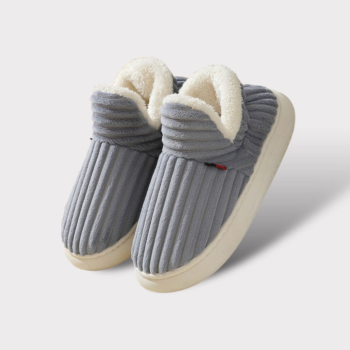Warm & ergonomic plush unisex slippers, ideal for ultimate indoor comfort. A cozy footwear gift for all.