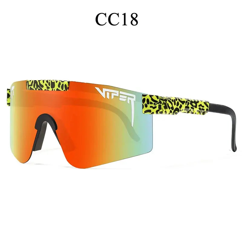 Person wearing unisex UV400 sports sunglasses while cycling on an outdoor trail.