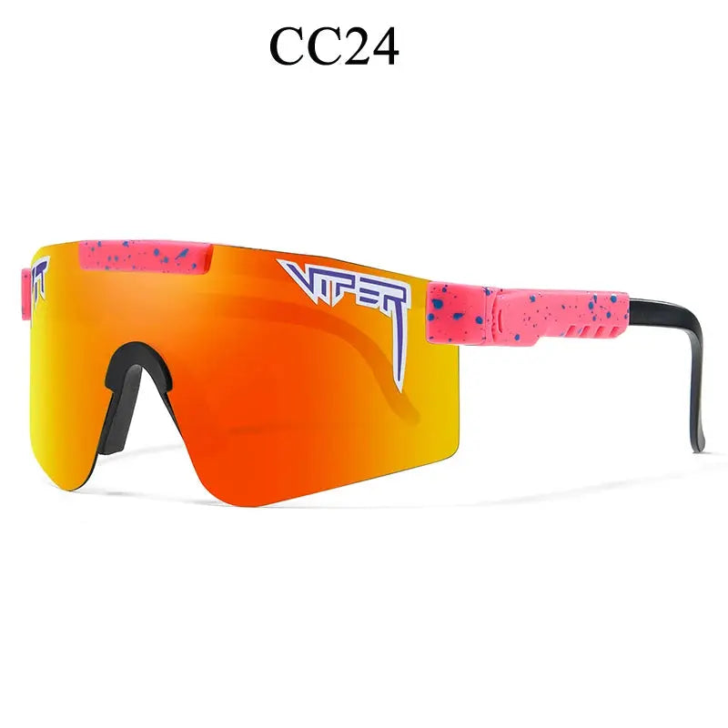 Unisex UV400 sports sunglasses resting on a helmet, ready for a cycling adventure.