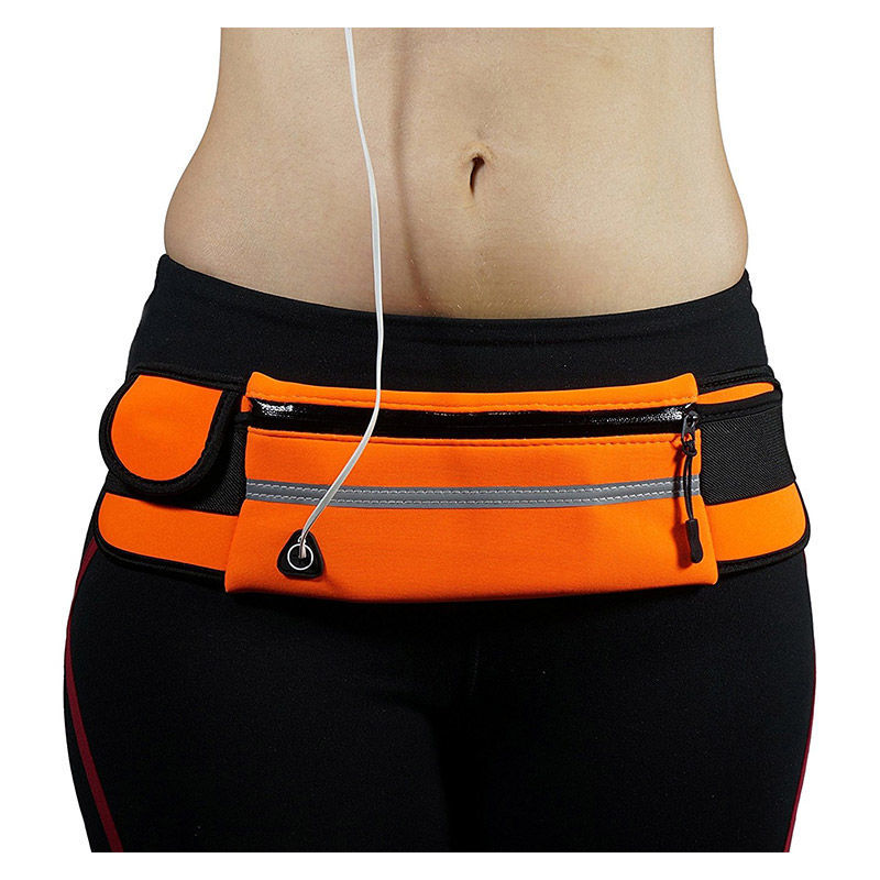 Athlete wearing a unisex water-resistant running waist pack with phone holder during a jog.
