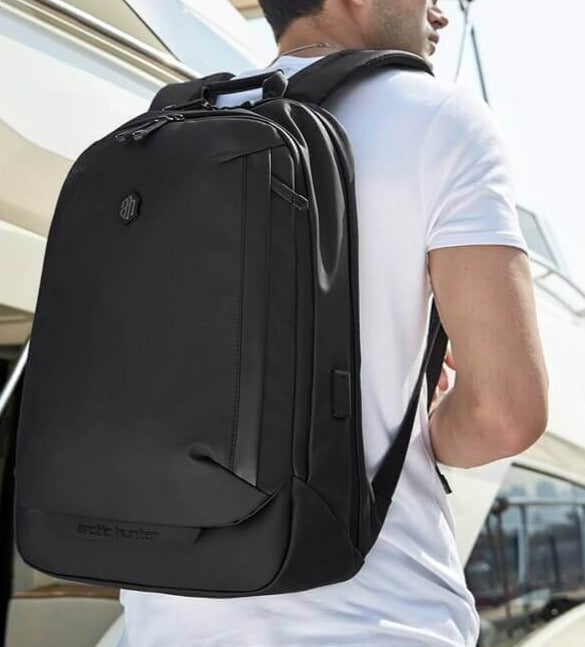 Unisex water-resistant travel backpack, black, multi-compartment design, ideal for outdoor adventures & daily commuting.