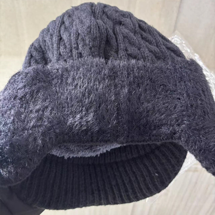 Cozy fleece-lined unisex trapper hat, knit with ear flaps for severe cold weather protection.