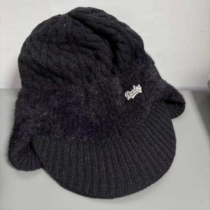 Unisex winter ear flap knit cap, classic trapper style for warmth during cold outdoor adventures.