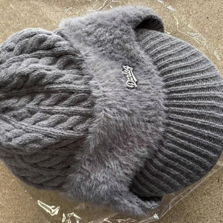 Durable polyester knit trapper hat, unisex design for maximum cold weather ear protection.