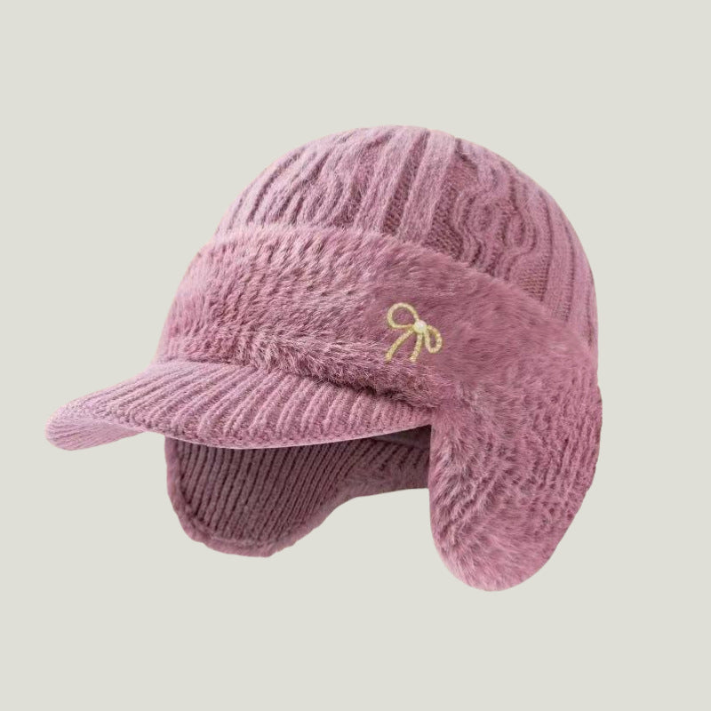 Unisex cold weather knit cap, trapper style with ear flaps, perfect for outdoor warmth.