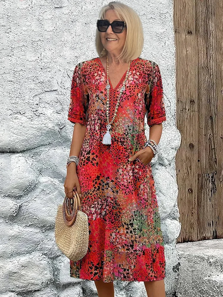 Elegant women's vibrant midi dress. Flowing design for comfortable and chic summer style.
