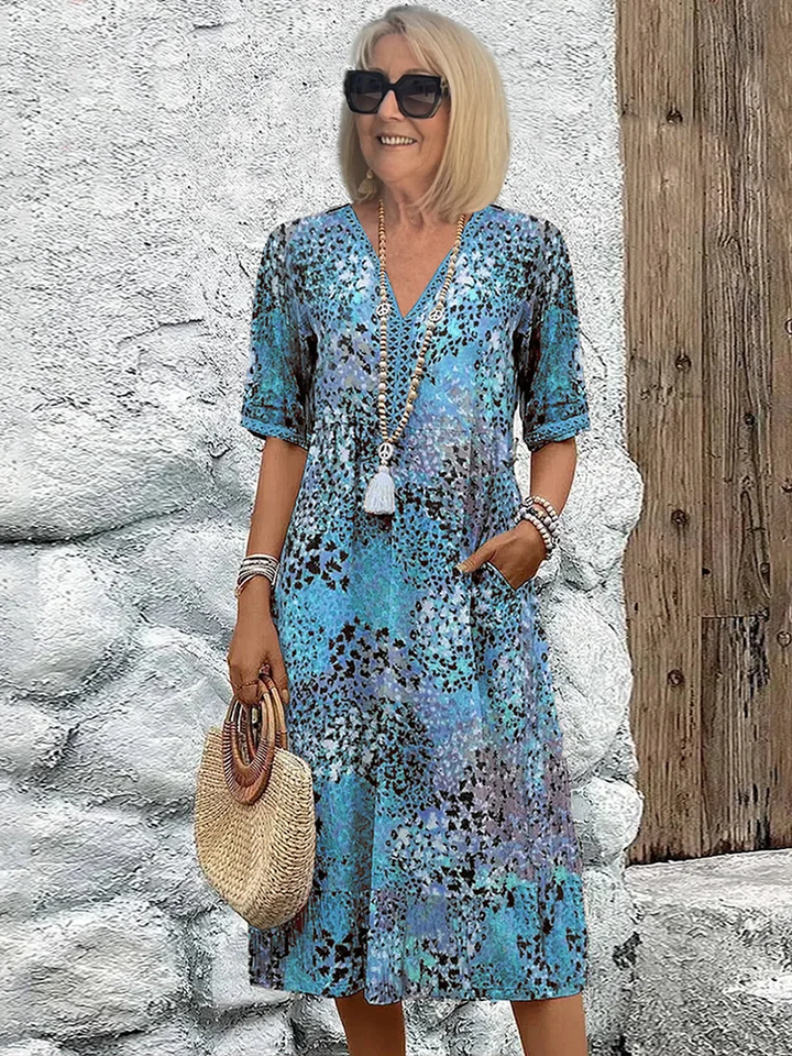 Comfortable colorful midi dress. A vibrant flowing design, ideal for spring fashion and casual chic.