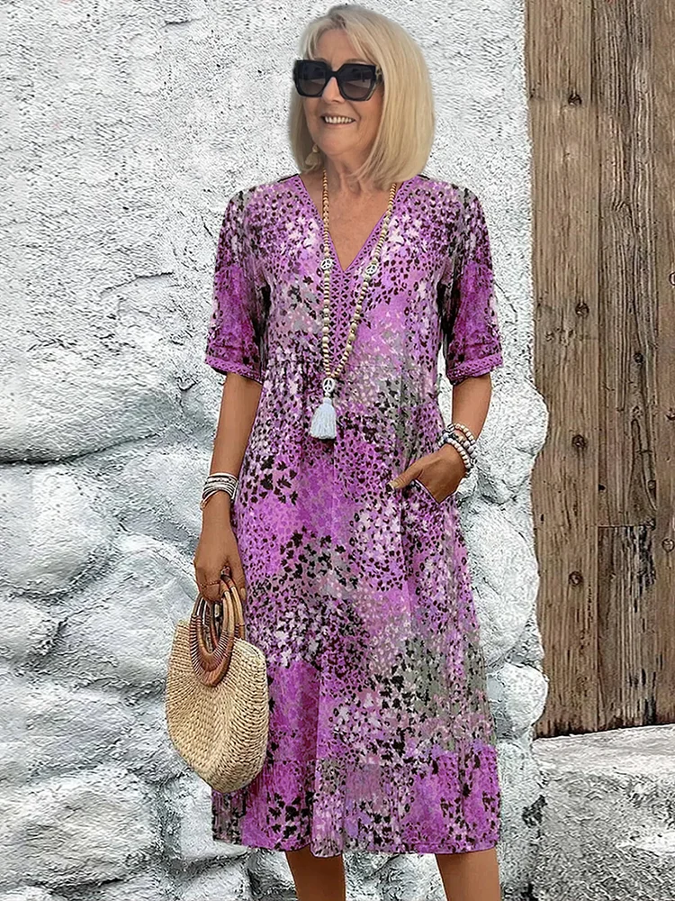 Stunning vibrant flowing midi dress. An elegant women's outfit for special occasions & summer events.