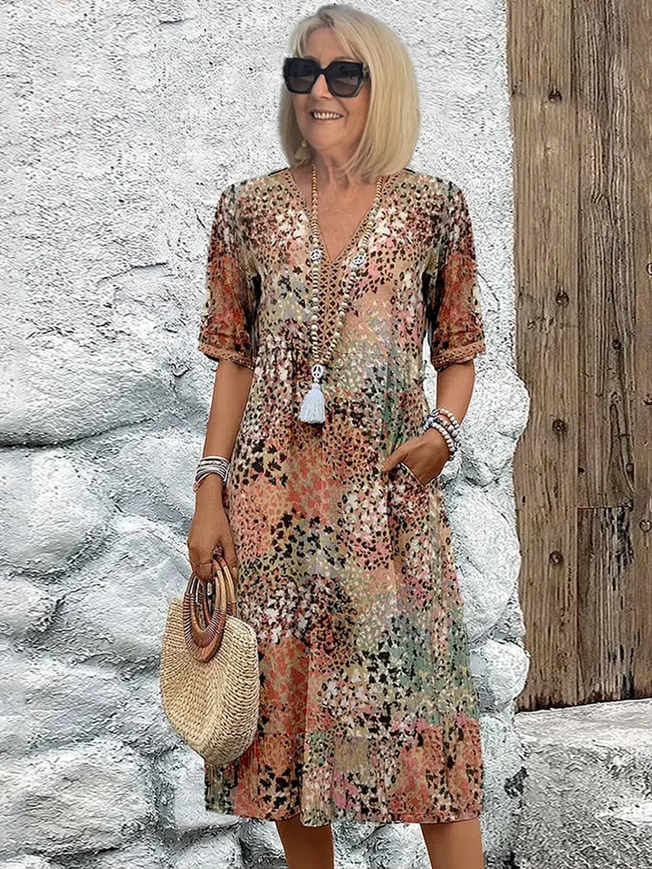 Women's effortless style: a vibrant flowing midi dress. Comfortable and elegant for daily wear.