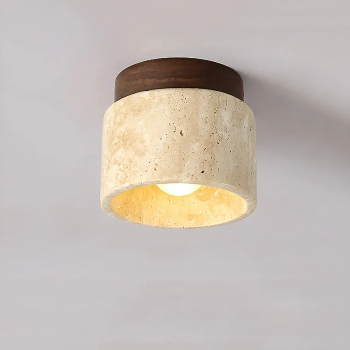 Serene Wabi Sabi Japanese ceiling lamp featuring a yellow marble and travertine stone finish. Ambient home lighting.