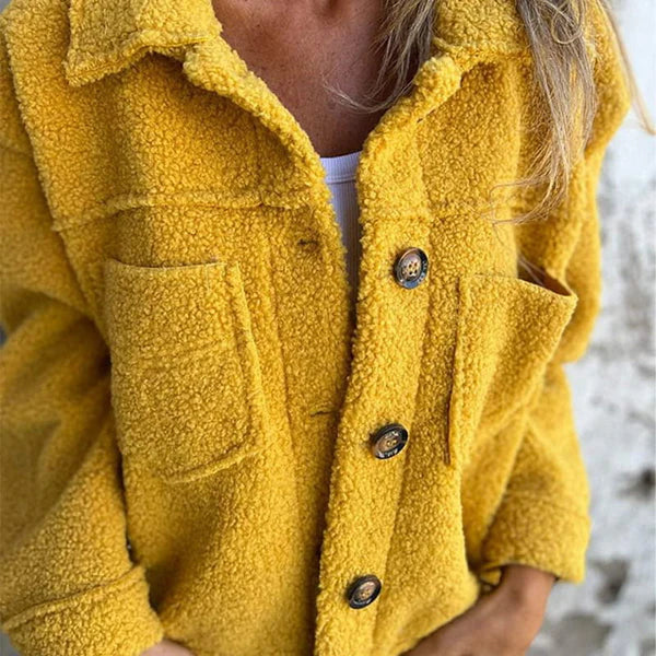 Soft women's teddy coat featuring a fashionable lapel collar & easy button front closure, cozy outerwear.