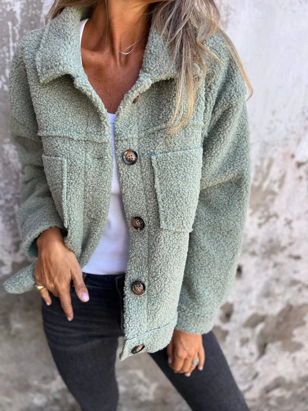 Chic women's fall teddy jacket, featuring a sophisticated lapel collar & cozy fabric for warmth.