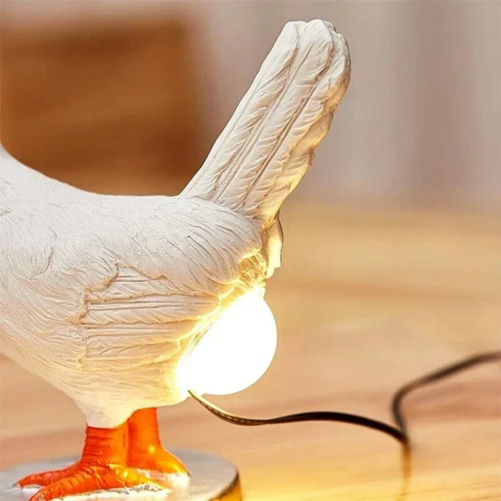 Whimsical LED chicken lamp for kids' room or funny home decor. Unique accent night light, battery-powered.