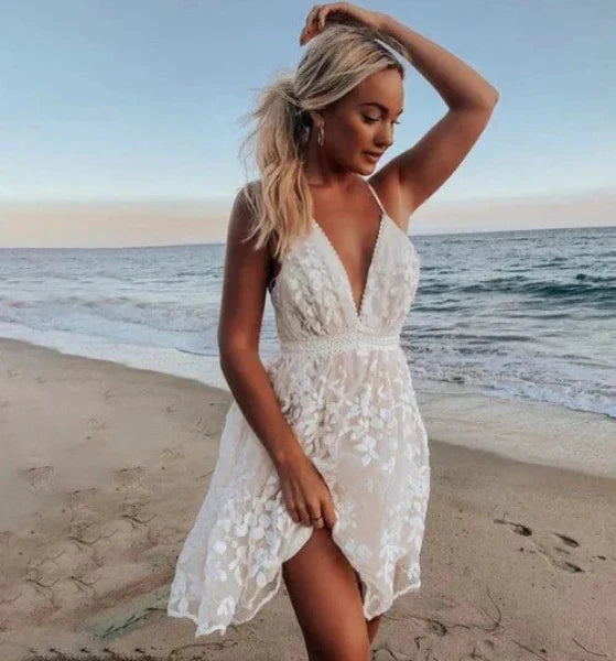 White floral halter neck mini cocktail dress for women, perfect for beach parties & summer wedding guests.
