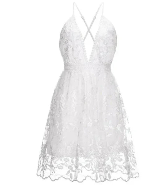 Stylish women's white halter neck mini dress. A chic cocktail party and beach summer dress.