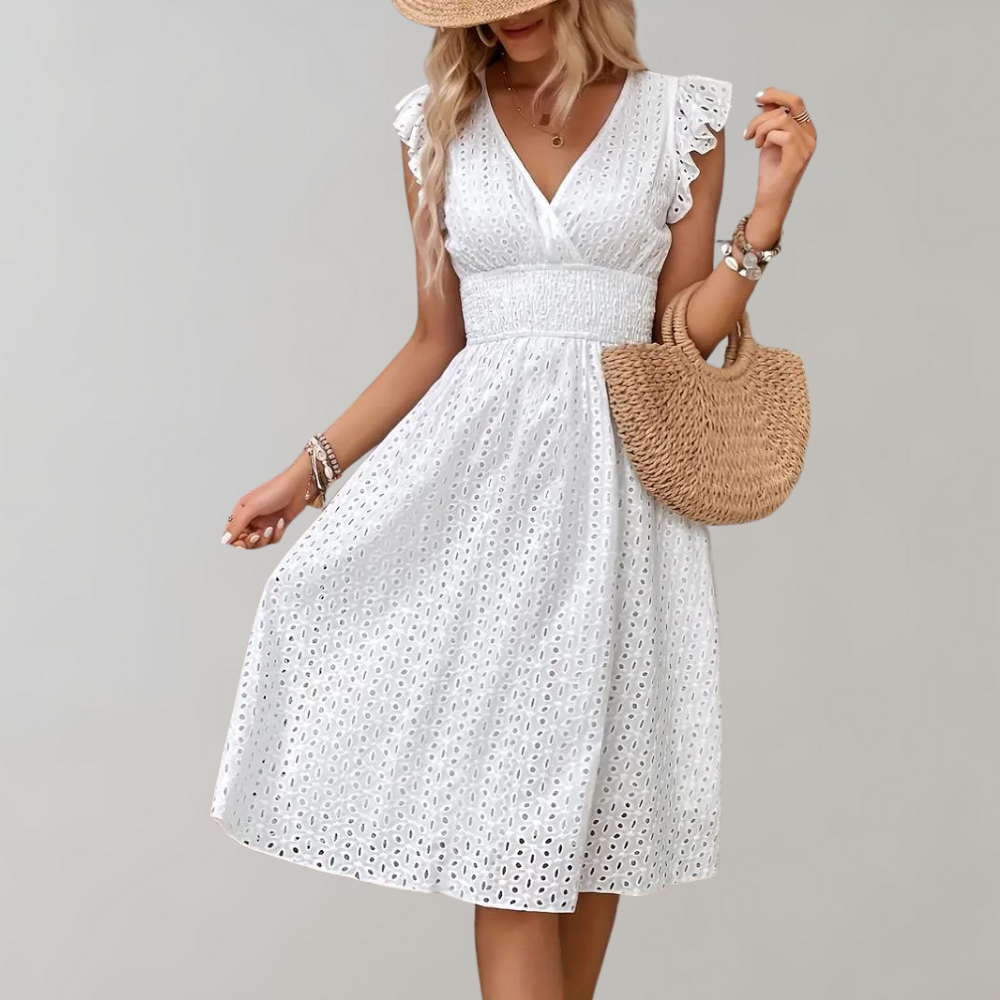 Stylish women's white flowy summer dress featuring chic ruffled sleeves. Ideal for a comfortable day out.