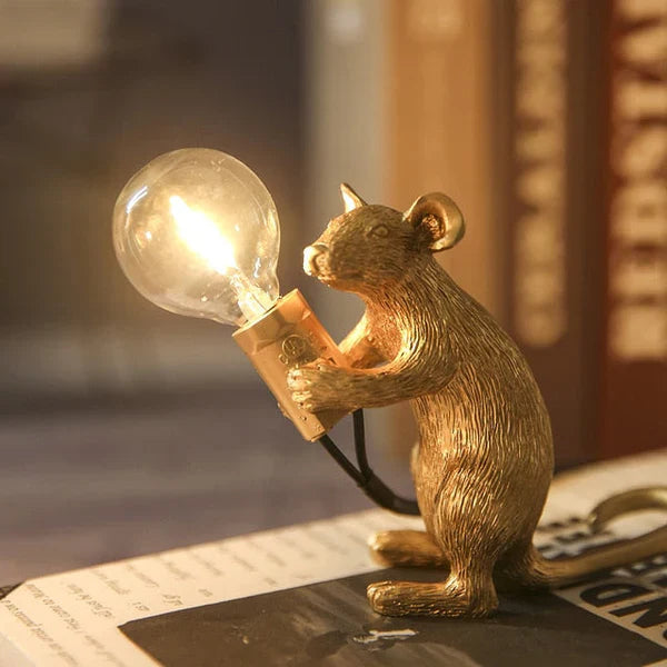 Adorable gold and white SqueakLight mouse lamp, a whimsical resin table lamp ideal for desk or home accent.