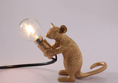 SqueakLight mouse desk lamp, a whimsical gold & white resin lamp for playful home decor.
