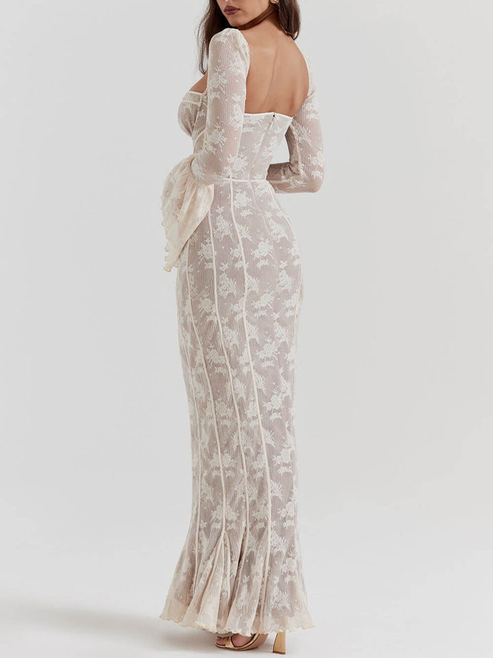 Women's long white romantic maxi dress featuring a sculpted bodice, fluted sleeves, and a flowing skirt for elegance.