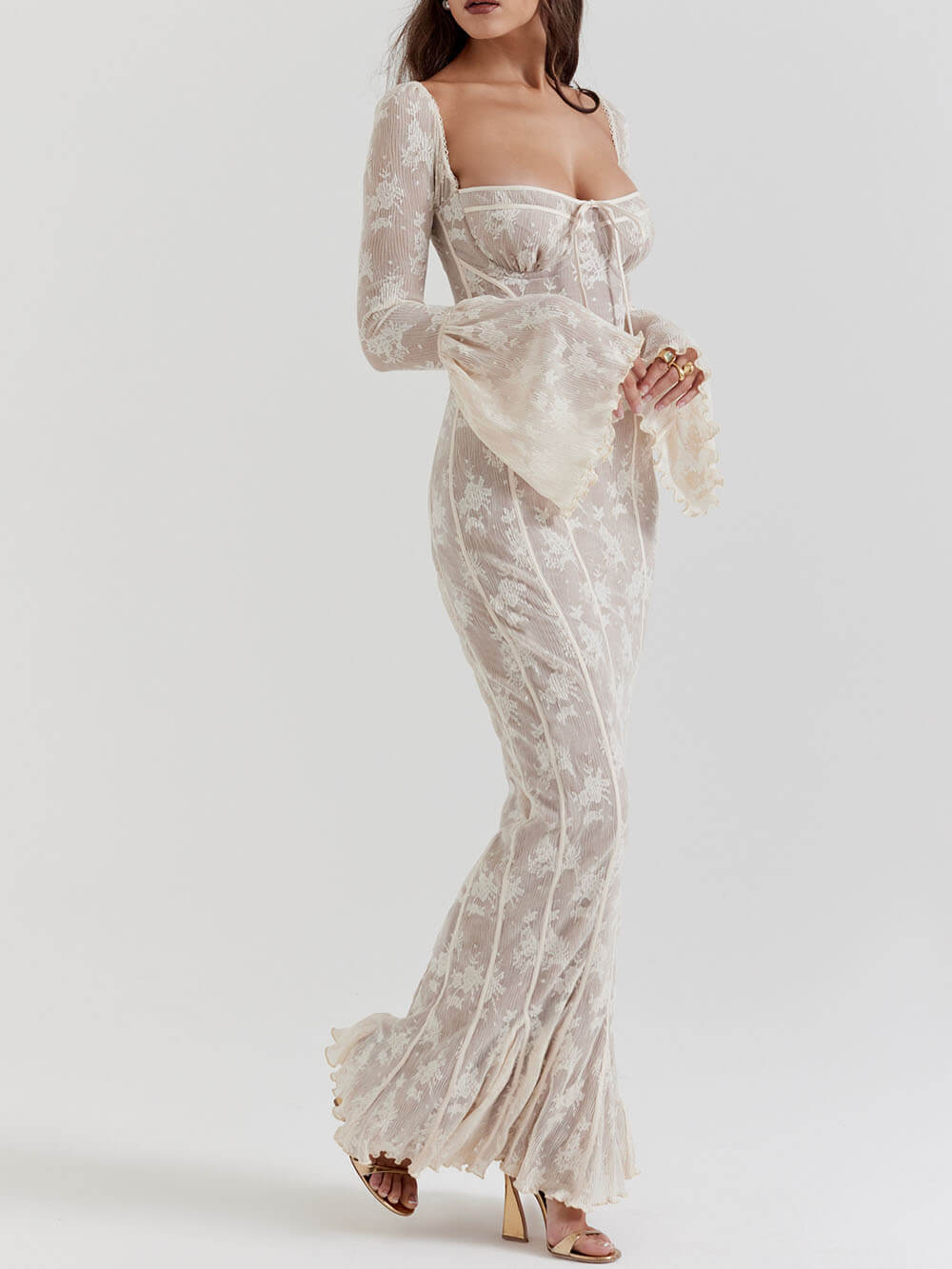 Stunning women's white elegant maxi gown with a sculpted bodice and fluted sleeves, perfect for formal events.