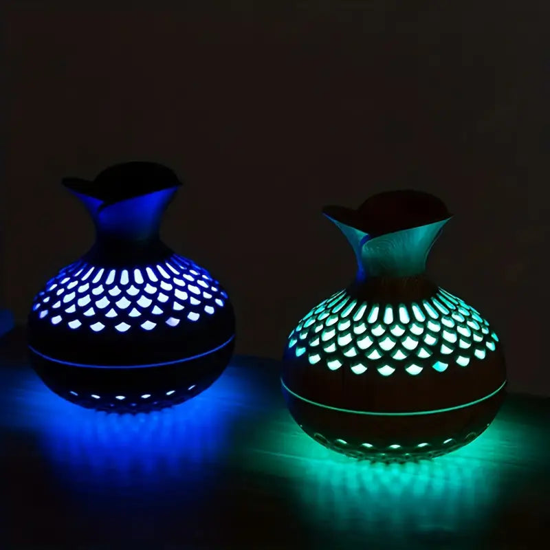 Modern ultrasonic essential oil diffuser with soft light, enhancing home aromatherapy & relaxation in any space.