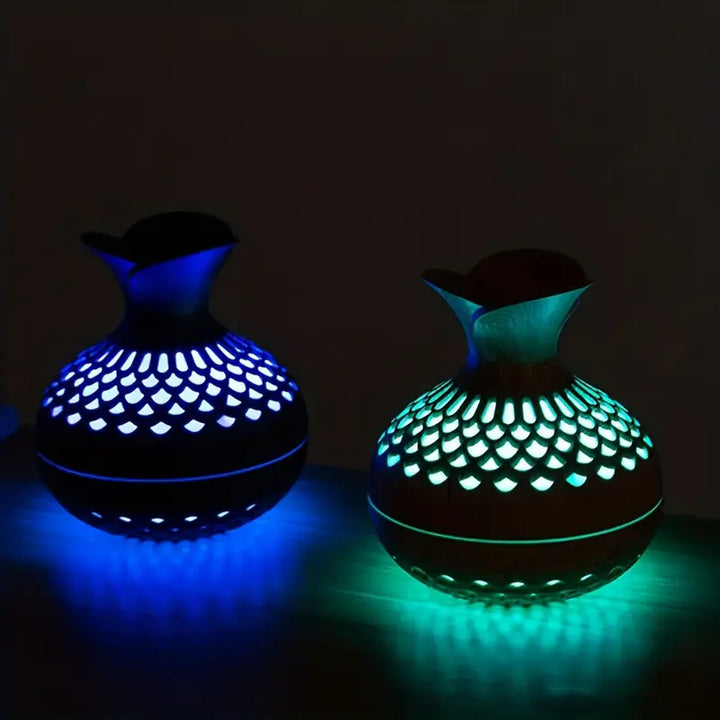 Modern ultrasonic essential oil diffuser with soft light, enhancing home aromatherapy & relaxation in any space.