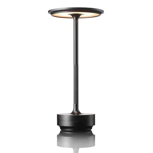 Dimmable touch table lamp, wireless & rechargeable, enhancing bedroom or living room ambiance.