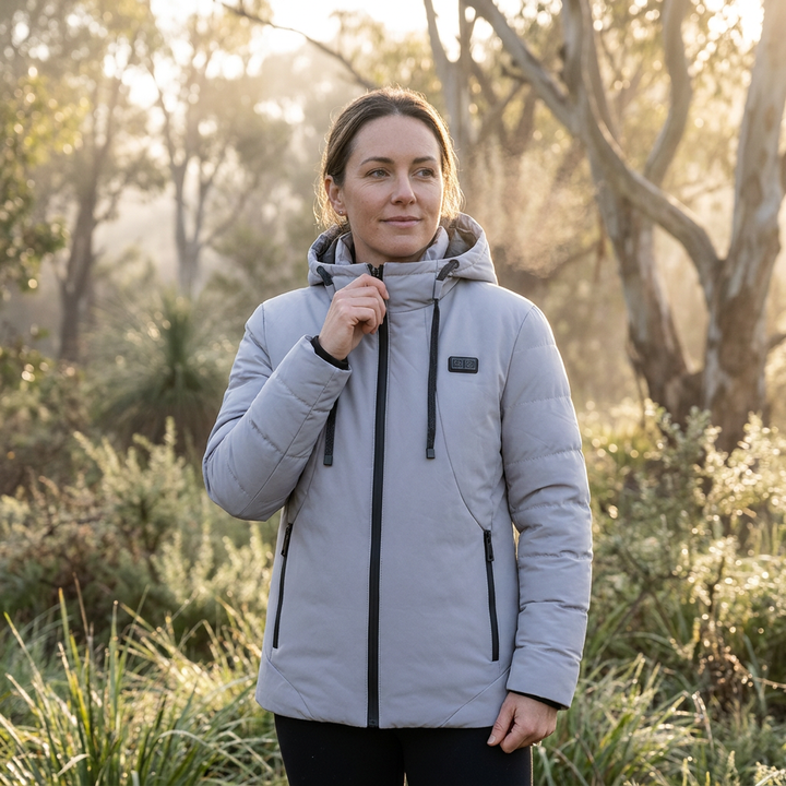Women's warm 11-zone heated puffer jacket with hood, excellent for cold weather & outdoor wear.