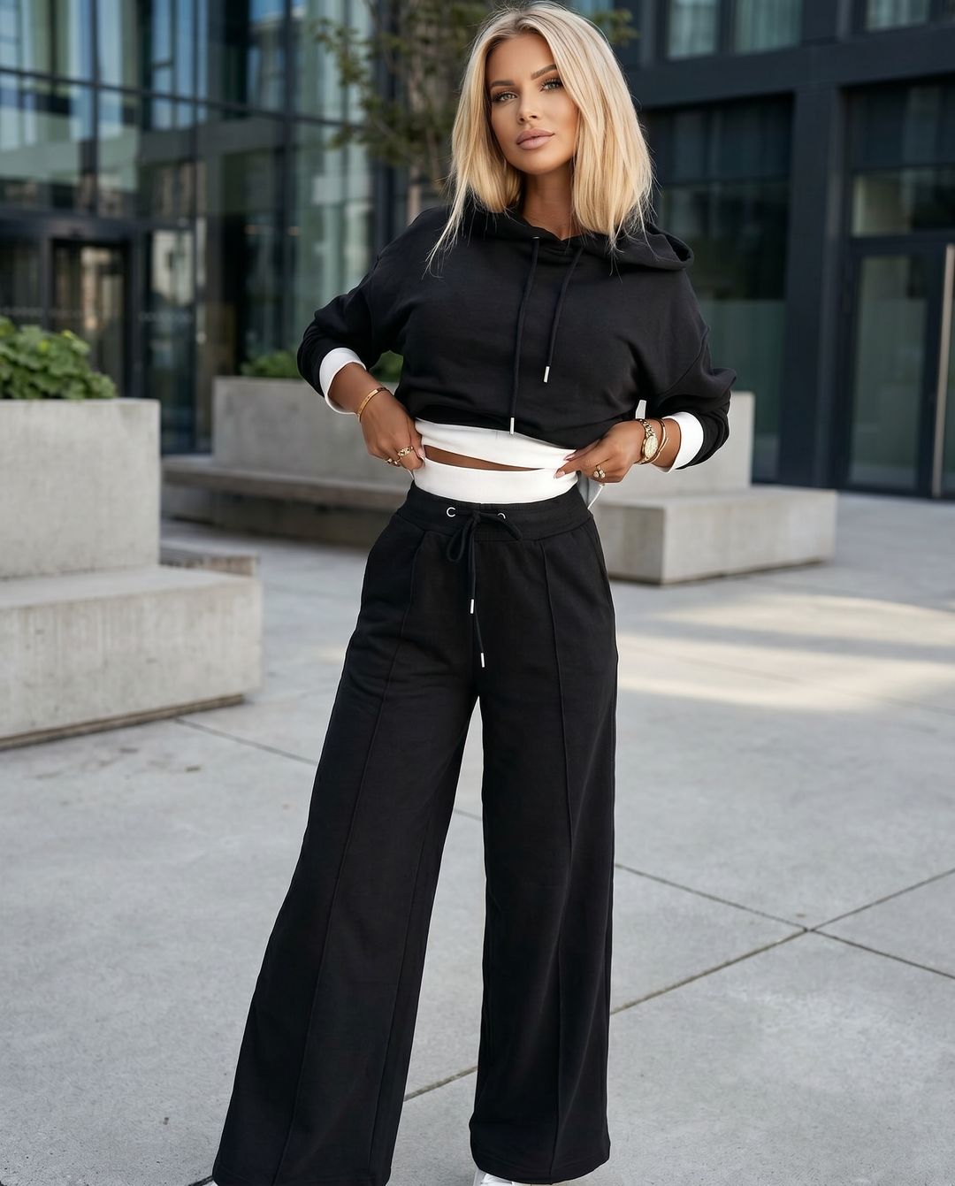 Cozy women's two-piece tracksuit featuring a comfy hoodie and stylish wide-leg trousers, ideal for casual wear.