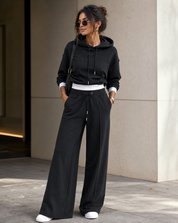 Comfortable women's two-piece co-ord set: soft hoodie and trendy wide-leg pants for ultimate relaxation.