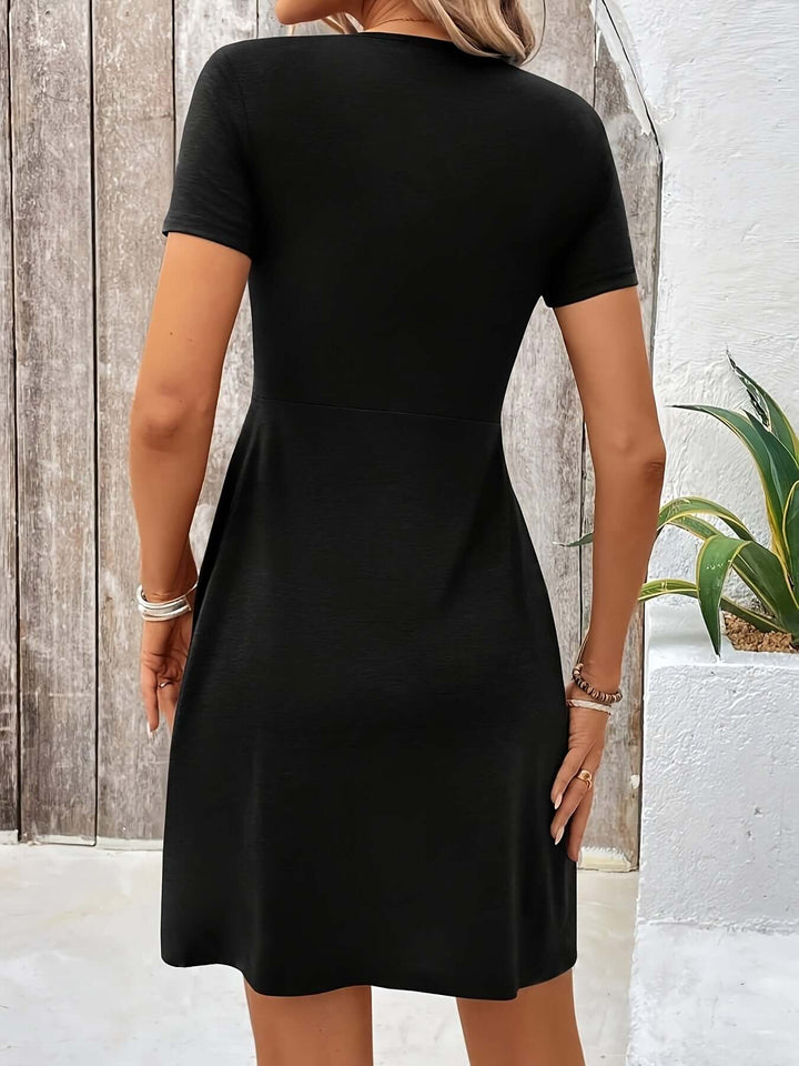 Versatile women's A-line dress with twisted detail, suitable for both casual and formal wear.