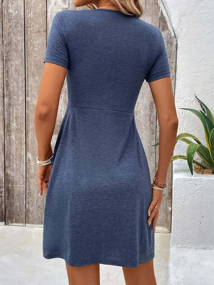 Close-up of the twisted detail on a comfortable women's A-line dress, highlighting its modern style.