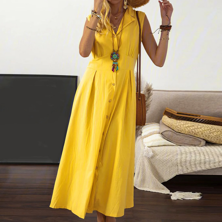 Chic women's sleeveless A-line midi dress, featuring a collared V-neck & button-down. Effortless cotton blend fashion.