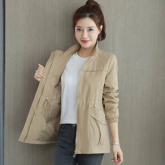 Women's adjustable waist spring trench coat, a lightweight and stylish outerwear piece for elegant fashion.