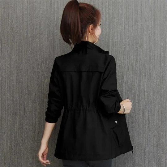 Stylish ladies' spring trench jacket with an adjustable waist, a versatile and lightweight piece for spring fashion.